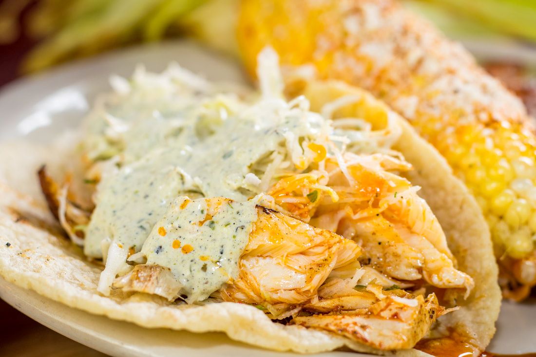 Best fish tacos in San Antonio, TX - Beto's fish tacos are made with grilled Alaskan pollock topped with fresh cilantro lime slaw and poblano sauce